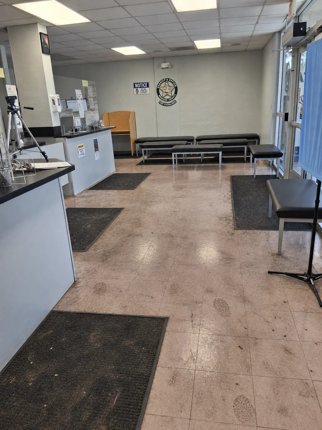 Dirty tile floor in a Broward County public facility before janitorial cleaning